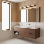 Travertine duo wall light shown lit against a warm backdrop