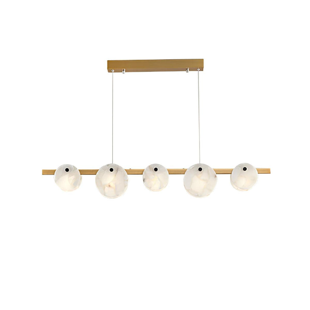 The chandelier in brass, five alabaster discs threaded along a slim horizontal bar, unlit on white.