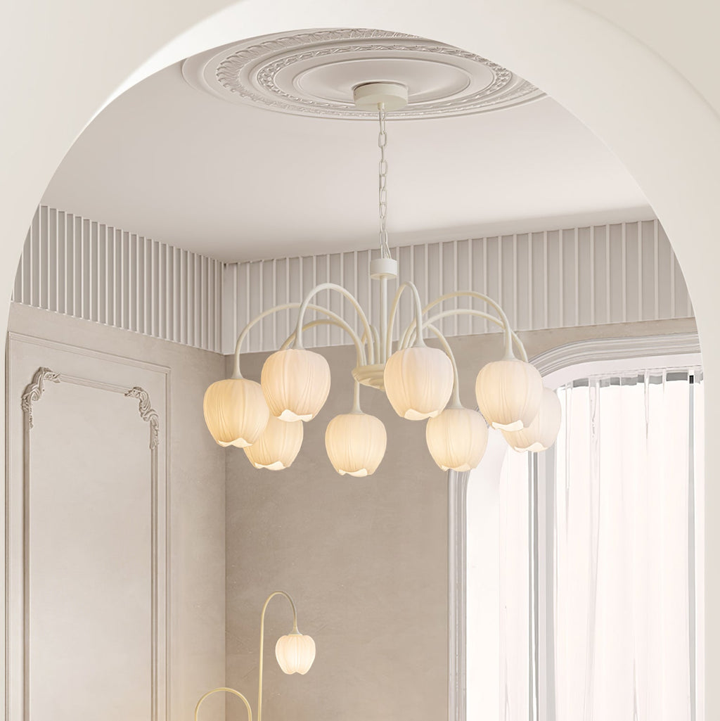 Tulip chandelier with botanical glass shades glowing