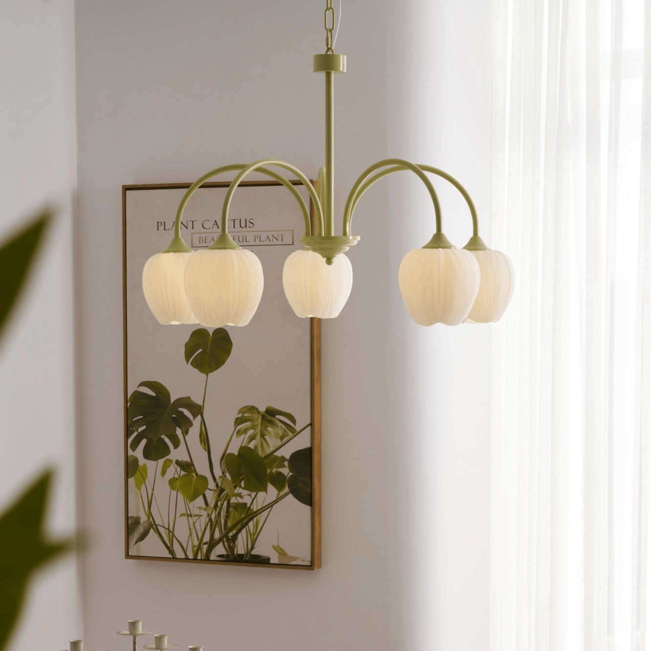 White glass tulip chandelier with matcha green frame detail