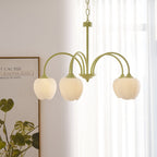 Tulip chandelier glowing warm above a table setting