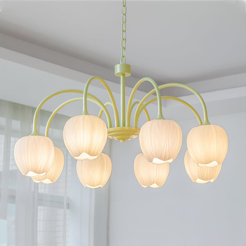 Matcha green tulip chandelier glowing in a styled space