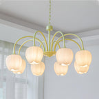 Matcha green tulip chandelier glowing in a styled space