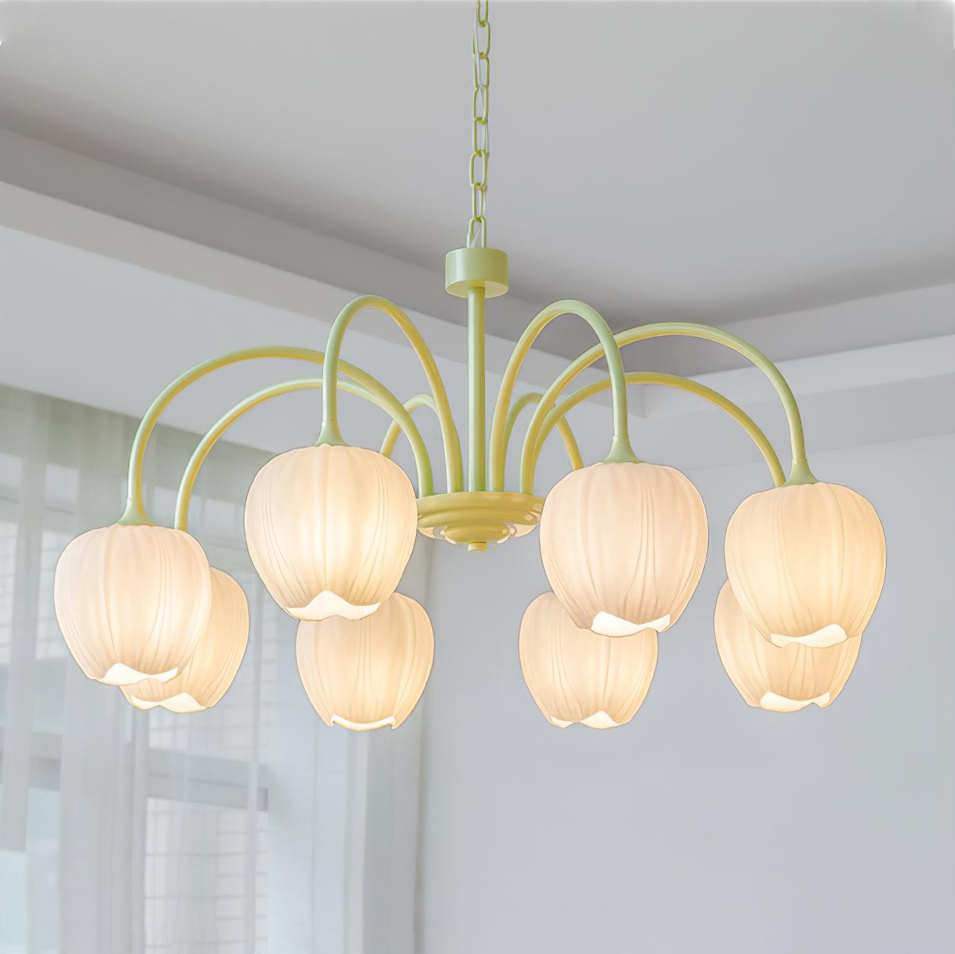 Matcha green tulip chandelier glowing in a styled space