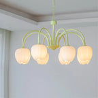Tulip chandelier glowing softly above a dining setting