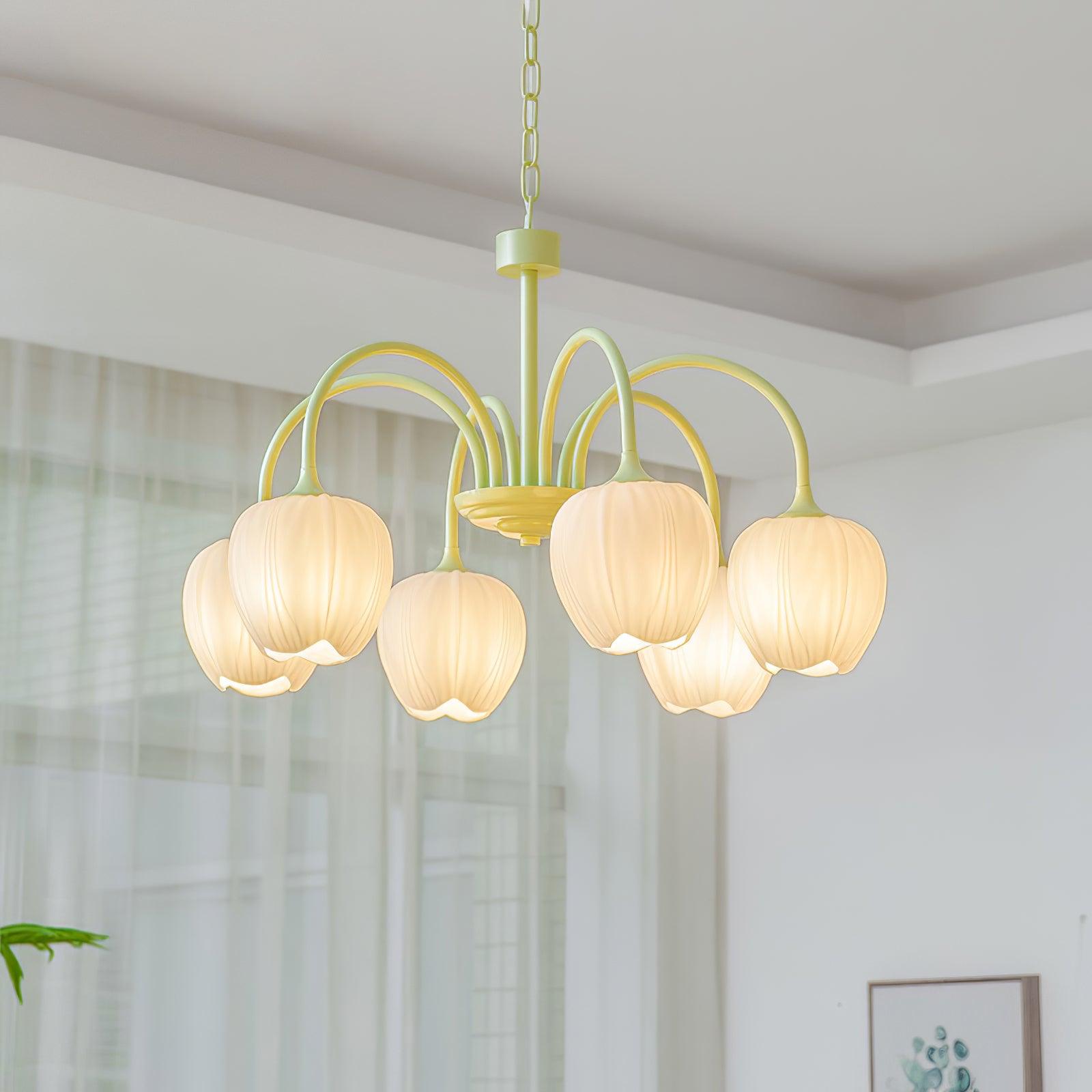 Tulip chandelier glowing gently in an interior space