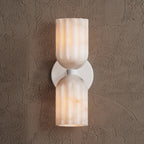 White-finished double wall sconce with alabaster shades, lit and seen straight from the front