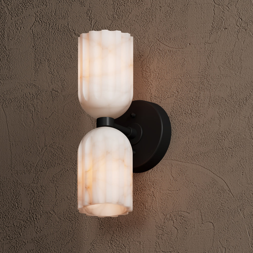 Matte black wall sconce seen at an angle, showing how far the arm projects from the wall