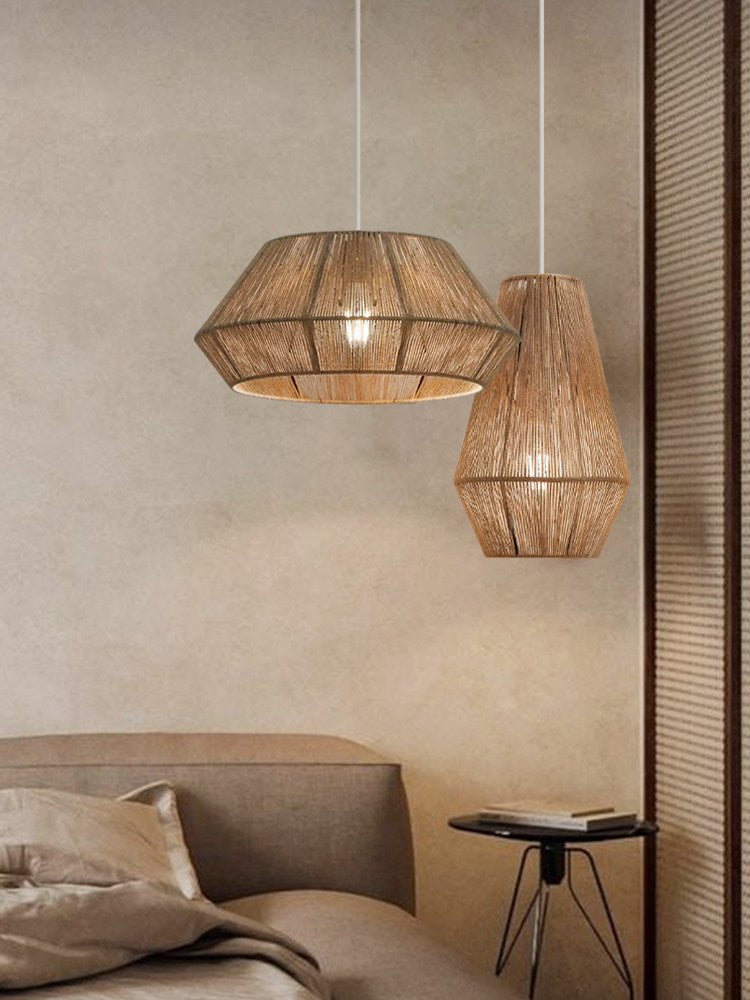 Beside a striped curtain in a bedroom, two jute rope Clérachic pendants pair a bowl-cone and teardrop shade.