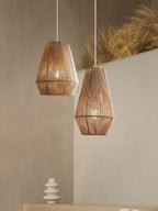 Against a plain wall beside dried pampas grass, two jute rope Clérachic pendants pair bowl-cone and teardrop shades.