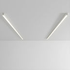 Two black Clérachic ceiling lights angle apart, both glowing warmly against a plain grey backdrop.