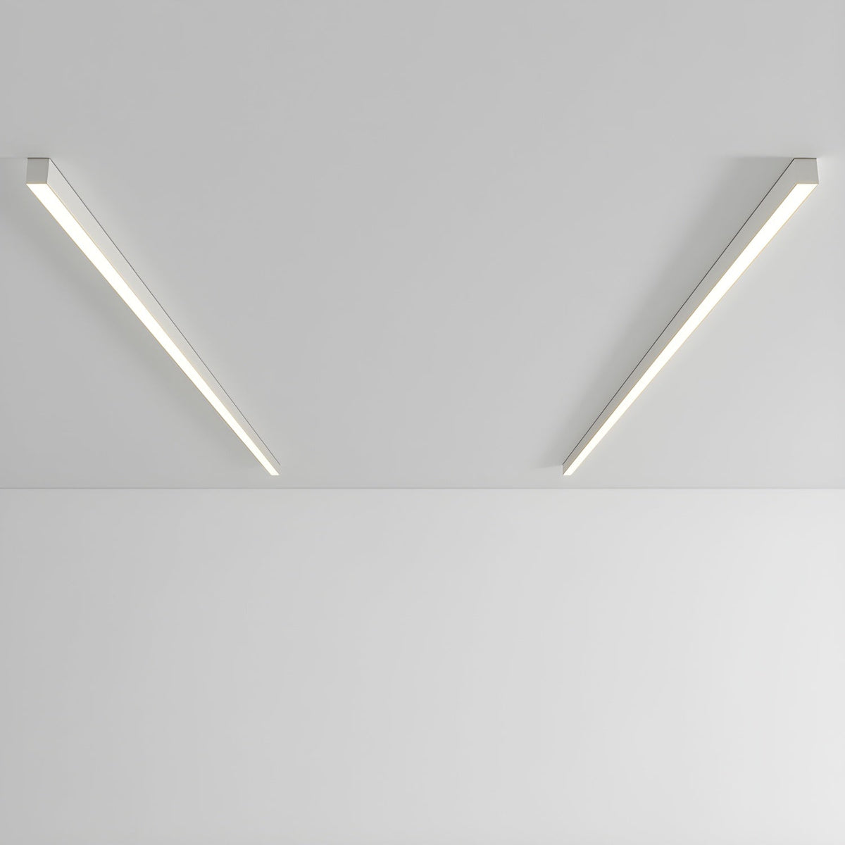 Two black Clérachic ceiling lights angle apart, both glowing warmly against a plain grey backdrop.