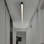 This Clérachic ceiling light glows warmly along a hallway ceiling, seen from a slightly different angle.