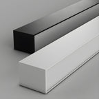 Close view of this Clérachic ceiling light's square profile in both black and white finishes, unlit against grey.