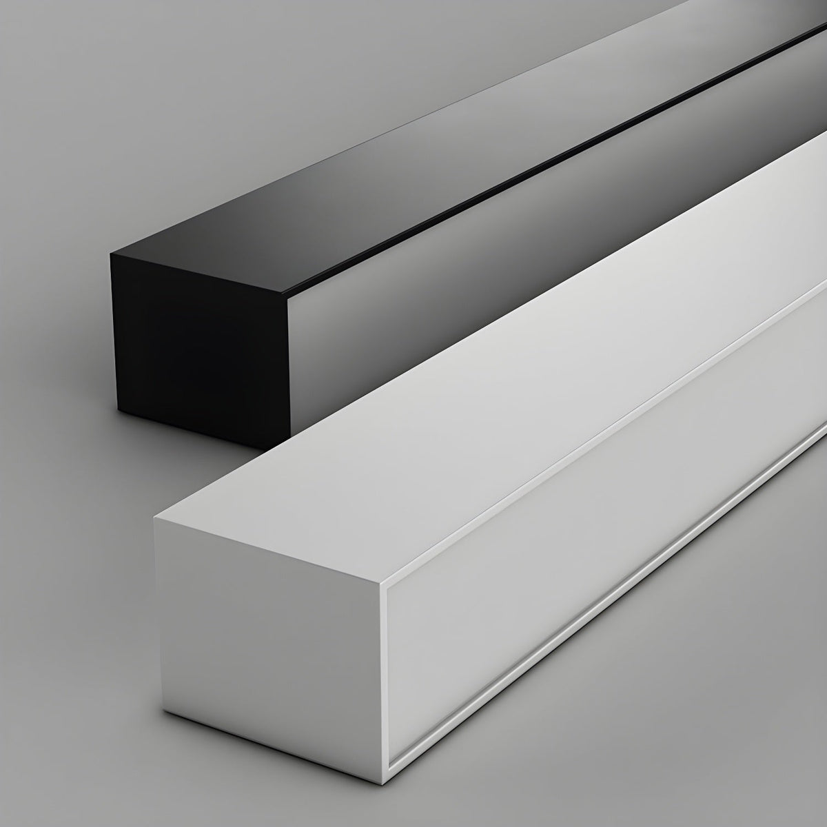 Close view of this Clérachic ceiling light's square profile in both black and white finishes, unlit against grey.
