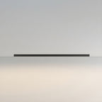 This Clérachic ceiling light in black lies unlit against a warm, softly graduated backdrop from grey to cream.