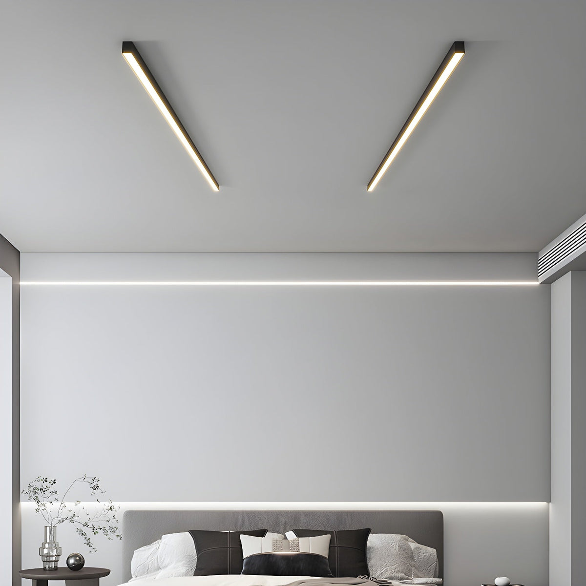 Two black Clérachic ceiling lights angle across a bedroom ceiling above a grey upholstered bed.