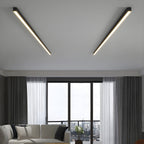 Two black Clérachic ceiling lights run flush across a living-room ceiling, above sheer curtains and floor-to-ceiling windows.