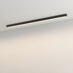 This Clérachic ceiling light, a slim black bar, sits unlit against a plain wall and ceiling corner.