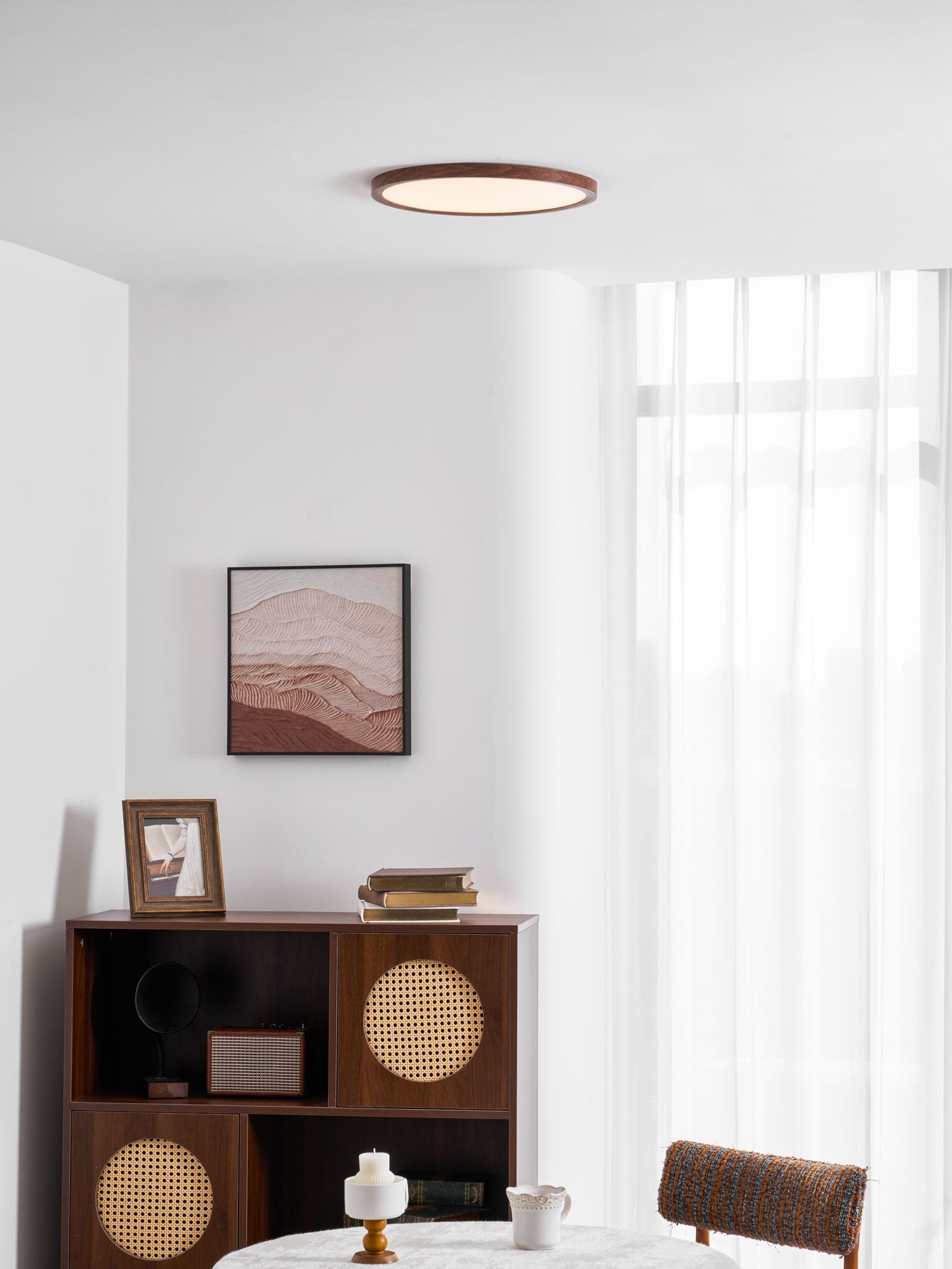 Round LED ceiling light showing its low-profile walnut frame