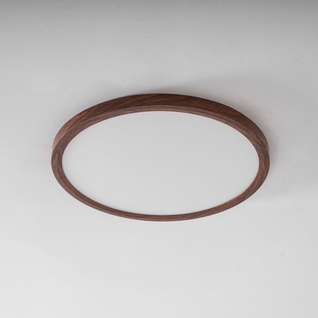 Walnut wood-grain ceiling light casting an even overhead glow