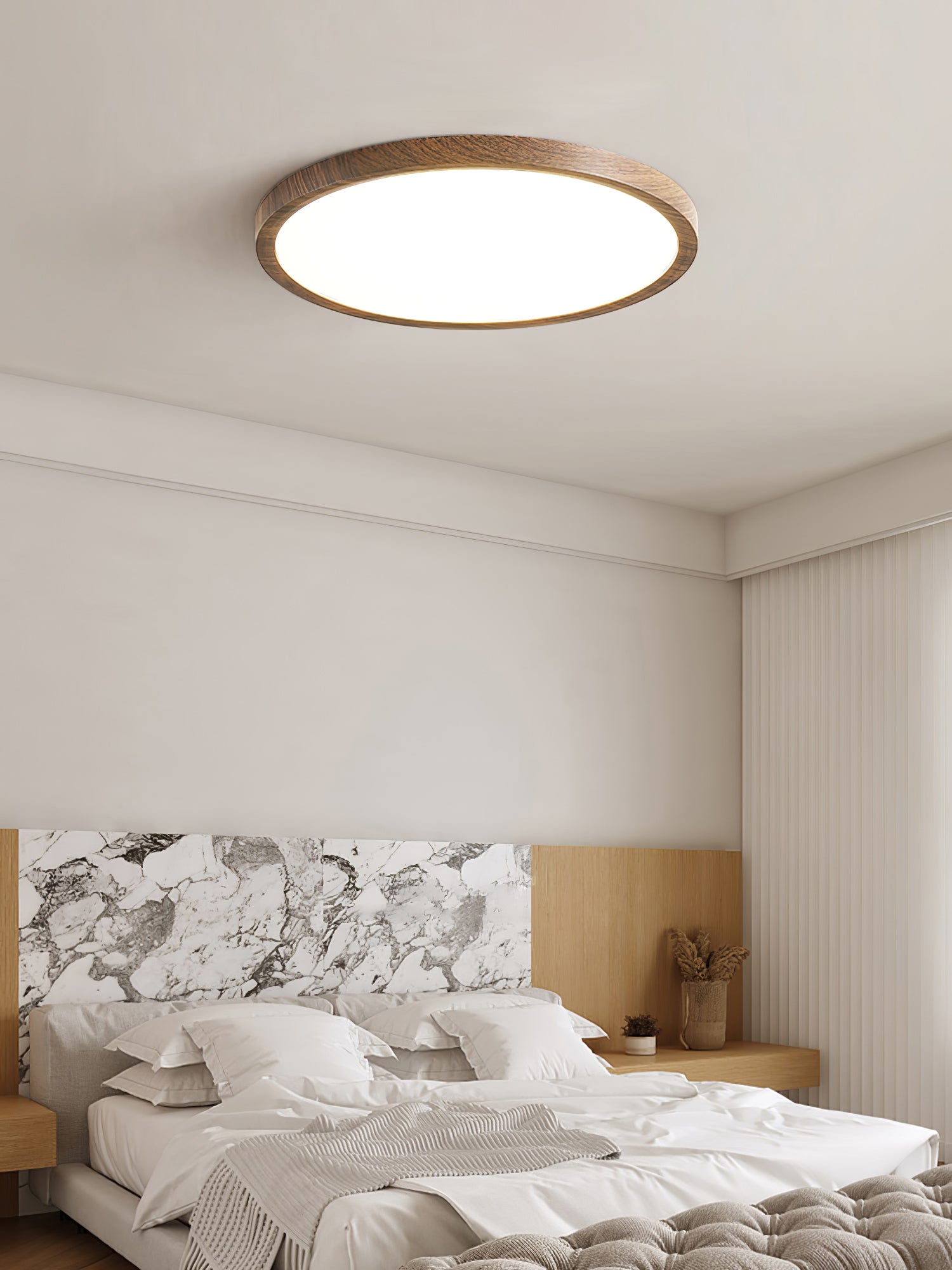Round ceiling light showing slim profile and warm walnut frame