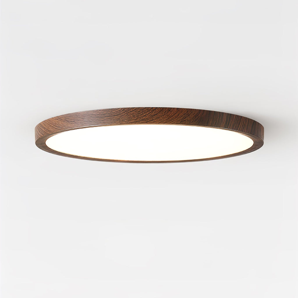 Slim round ceiling light showing walnut frame and acrylic diffuser