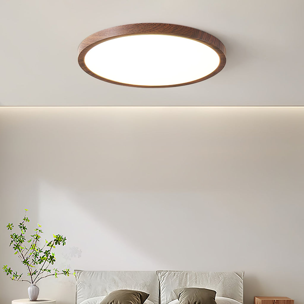 Walnut wood-grain ceiling light glowing softly against a white ceiling