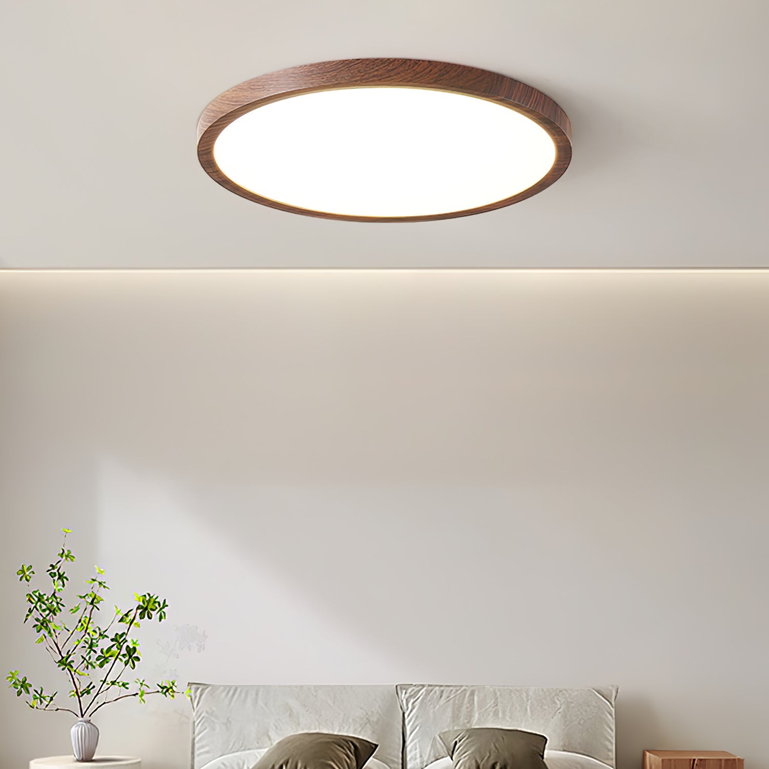 Walnut wood-grain ceiling light glowing softly against a white ceiling