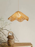 Near dried branches and a small rope-handled jug, this Clérachic pendant's radially woven hemp-rope shade glows warm.