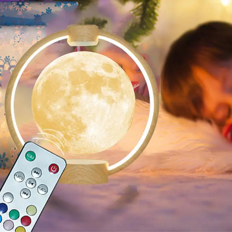 Clérachic moon lamp beside a sleeping child, remote handset in the foreground