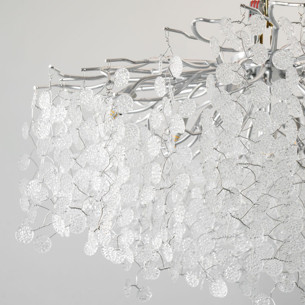 Close view of the silver branches on this Clérachic ceiling light, densely hung with unlit clear glass discs.