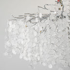 Close view of the silver branches on this Clérachic ceiling light, densely hung with unlit clear glass discs.