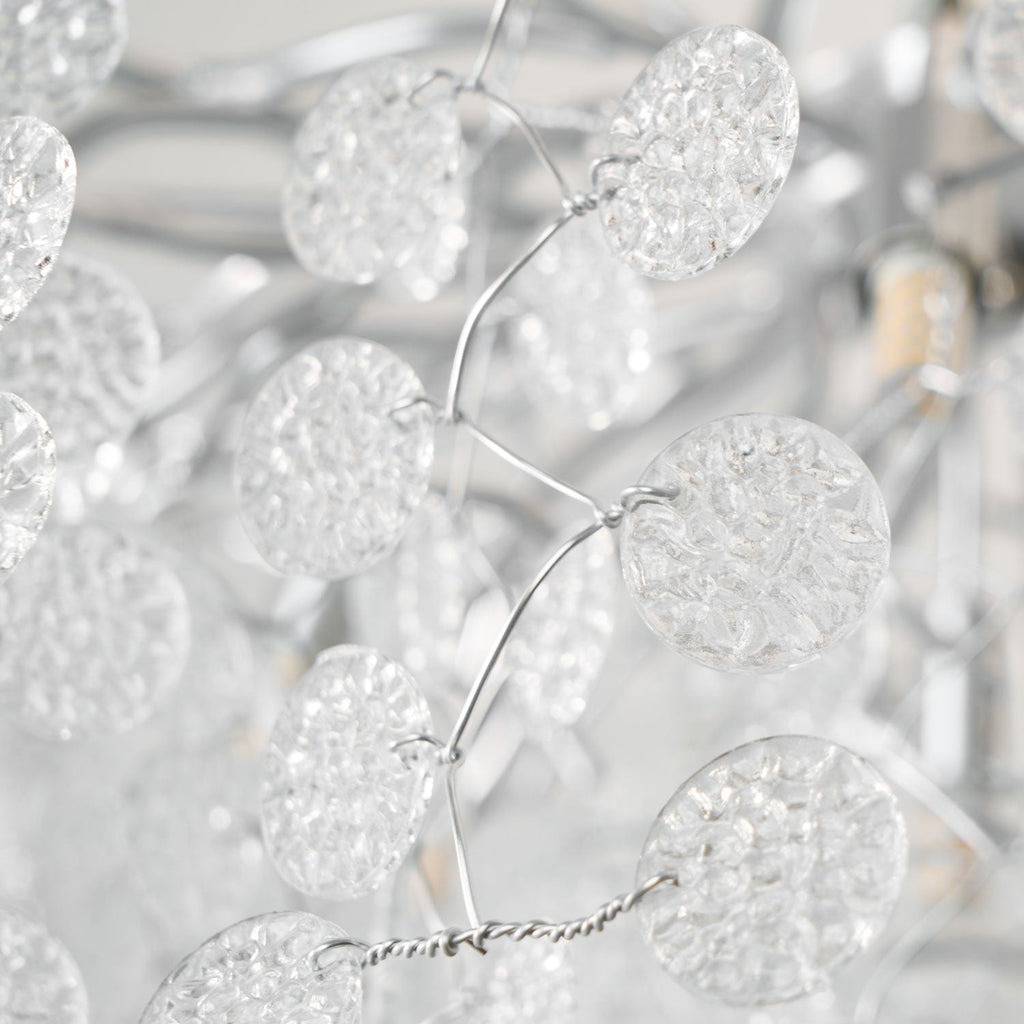 Close view of the clear glass discs and fine silver wire on this Clérachic ceiling light.
