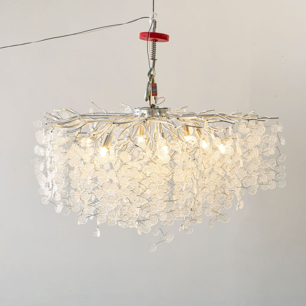 Viewed from a lower angle, this Clérachic ceiling light in silver glows warmly, its clear glass discs catching the light.