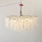 Viewed from a lower angle, this Clérachic ceiling light in silver glows warmly, its clear glass discs catching the light.