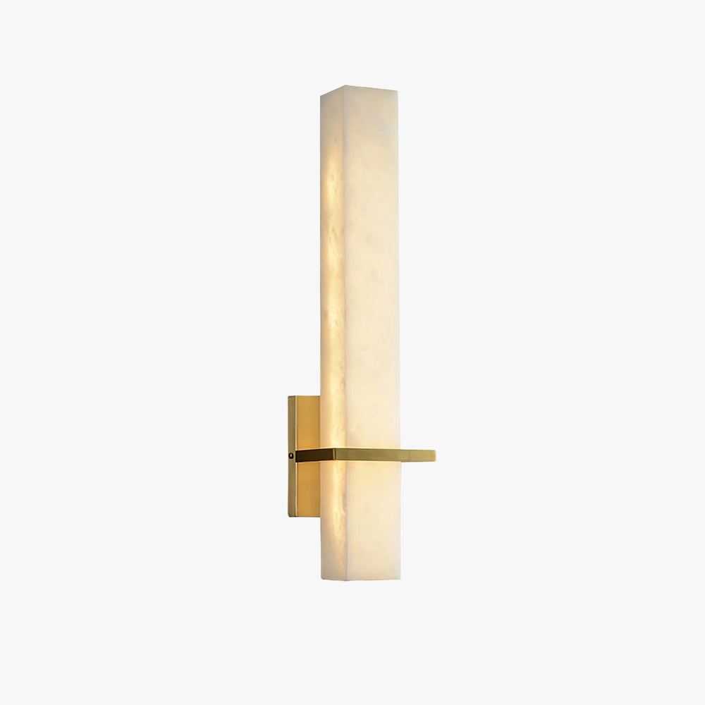 Studio shot of the alabaster wall light on white, lit, angled to show the brass arm and wall backplate