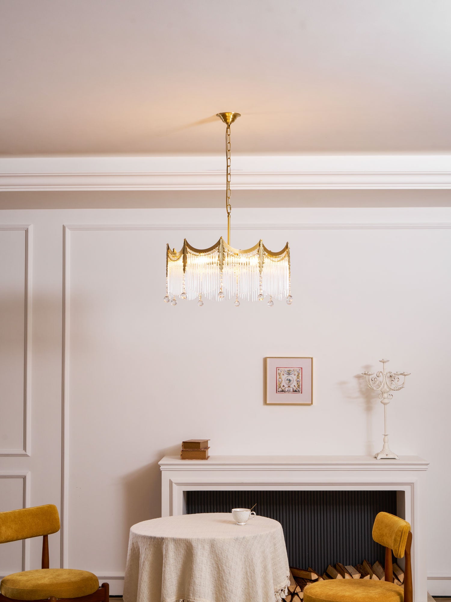 Copper chandelier with clear glass shades shown against a pale wall