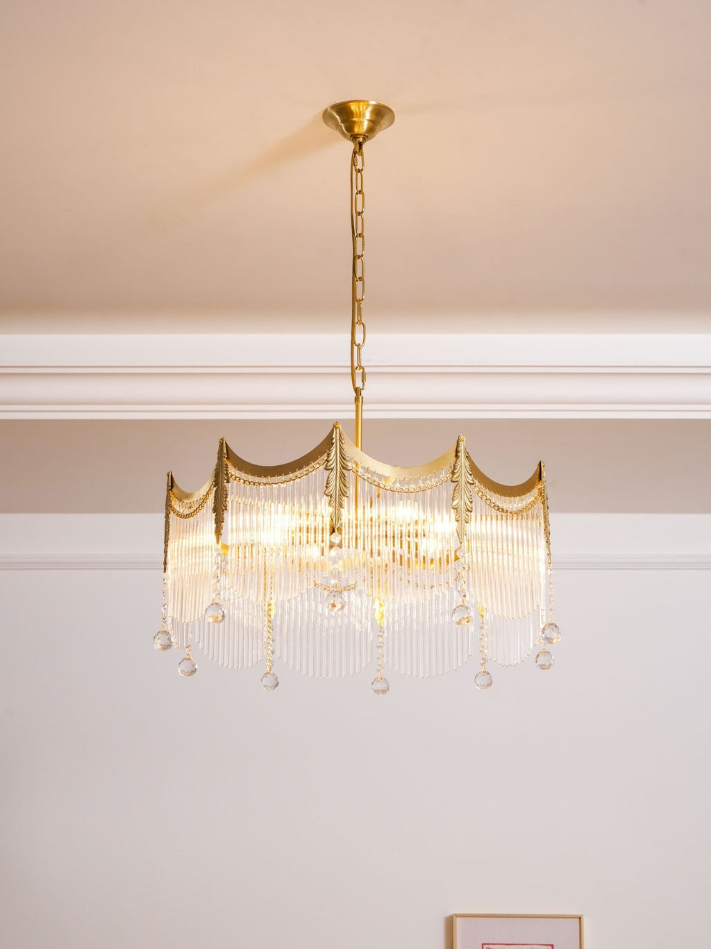 Side view of copper chandelier holding multiple clear glass shades