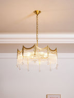 Side view of copper chandelier holding multiple clear glass shades