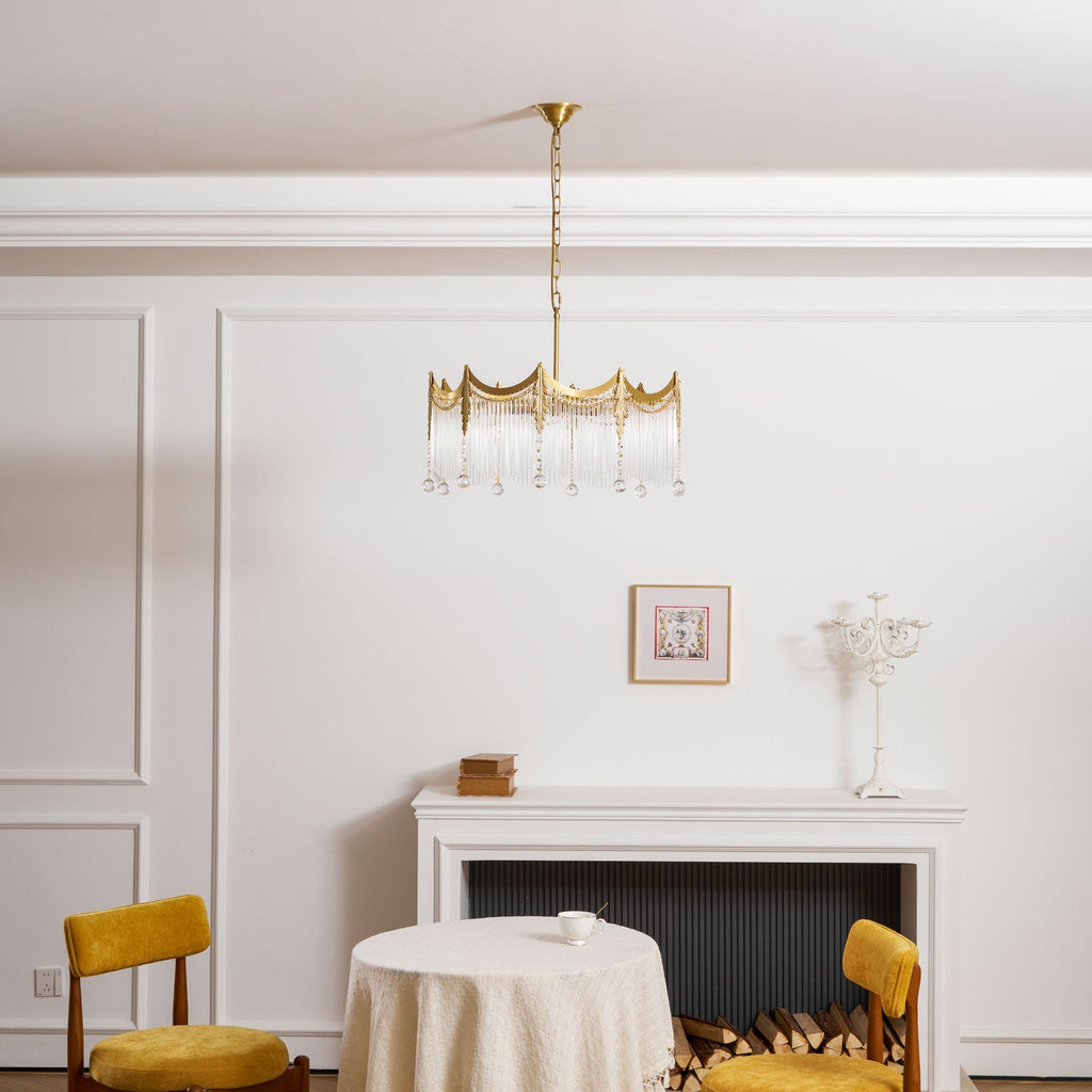 Copper chandelier with clear glass shades displayed in a styled room
