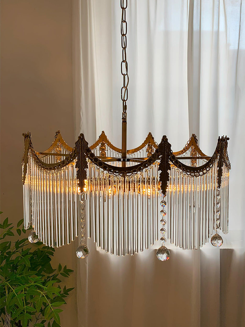 Copper-finish chandelier with clustered clear glass shades over a table setting