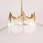 Copper chandelier with clear glass shades highlighting its sculptural form