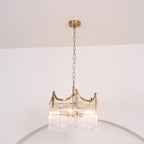 Detail of copper finish and clear glass shade arrangement on the chandelier
