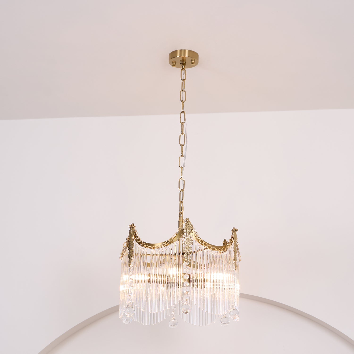 Detail of copper finish and clear glass shade arrangement on the chandelier