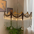 Side profile of multi-light copper chandelier with clear glass shades