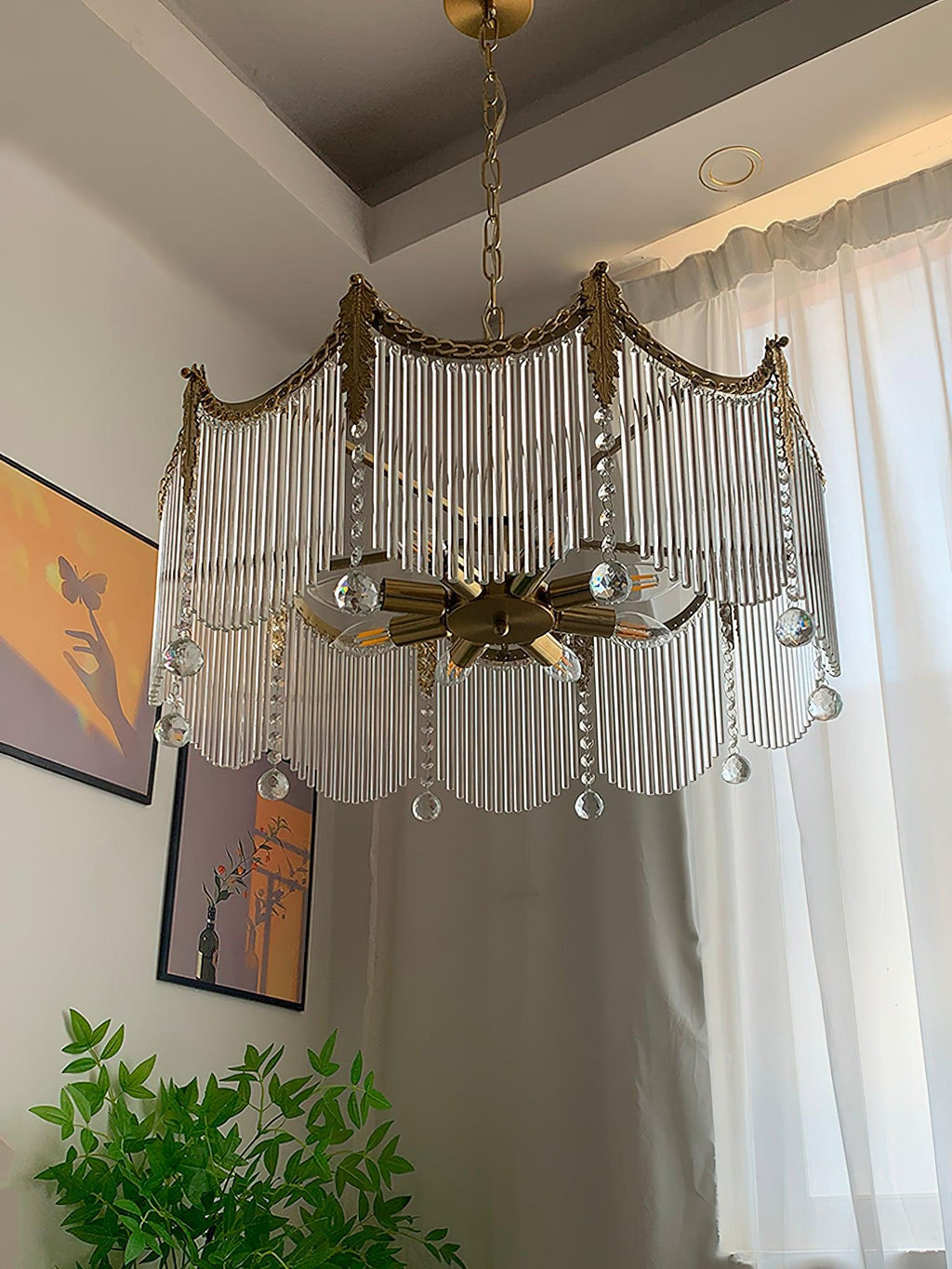 Copper chandelier with clear glass shades hanging in a modern dining area