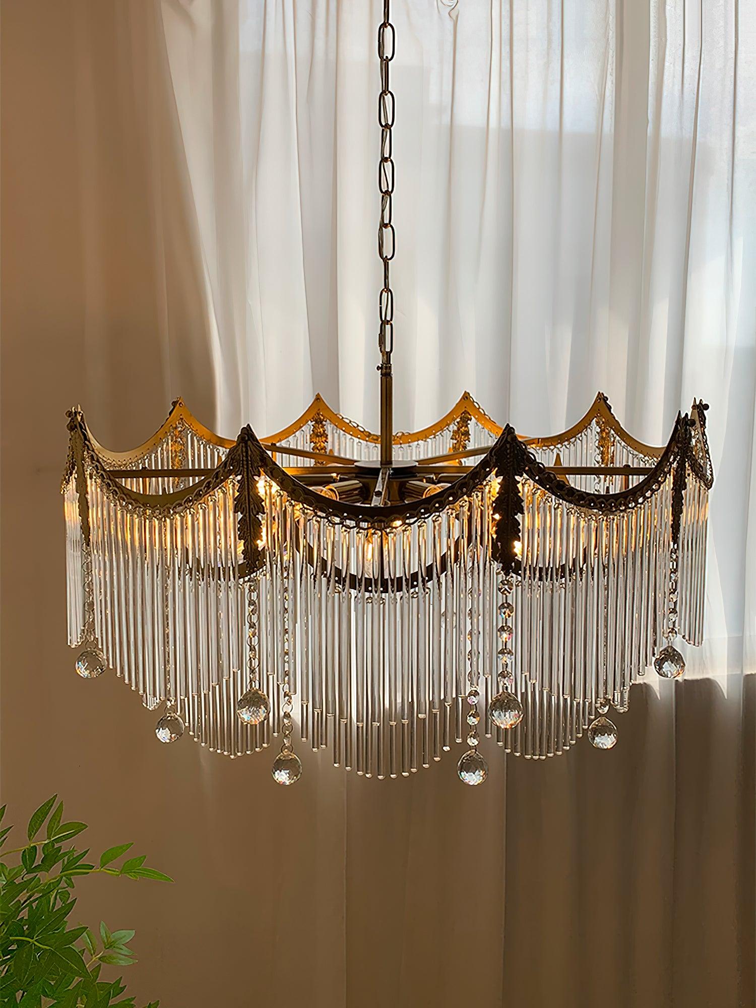 Full view of copper-finish multi-light chandelier with clear glass shades