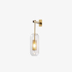 Brass wall lamp with glass shade detail highlighting its finish