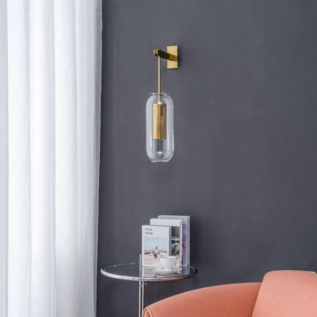 Brass-finish wall lamp with glass shade shown up close
